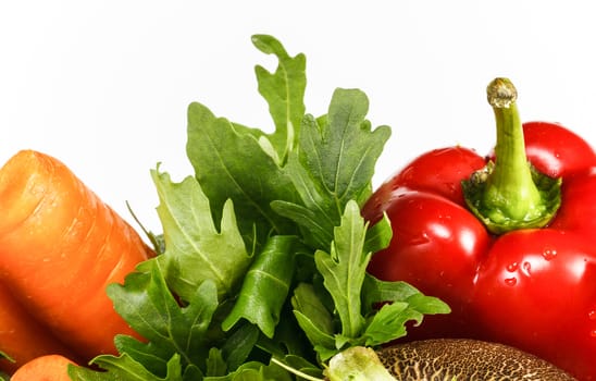 Fresh vegetables on the white background with copy space on top half. Close up