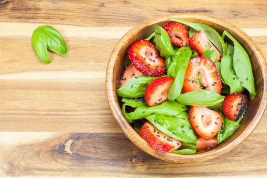 Strawberry Spinach Salad with Poppy seed and sesame dressing. Copy space