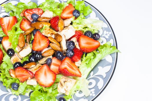 Berry salad with chicken, almond and lettuce. Summer salad.