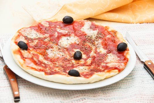 Authentic Italian, hand made Pizza Margherita with tomato, mozzarella cheese and oregano.