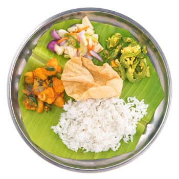 Overhead view of full length Indian vegetarian mixed rice isolated on white background.