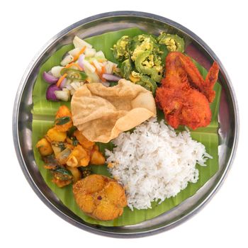 Overhead view of full length Indian mixed rice isolated on white background.