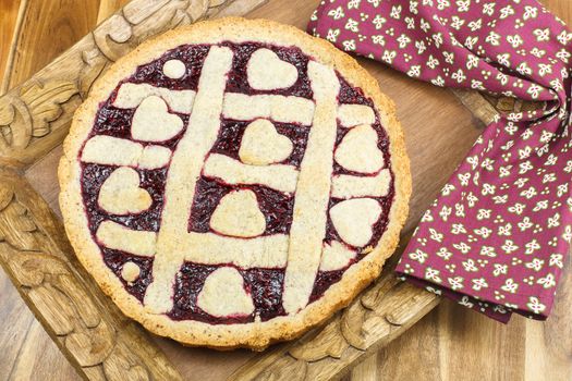 Fresh raspberry pie. Fresh Baked Berry Pie with Lattice Crust. Pastry heart on top