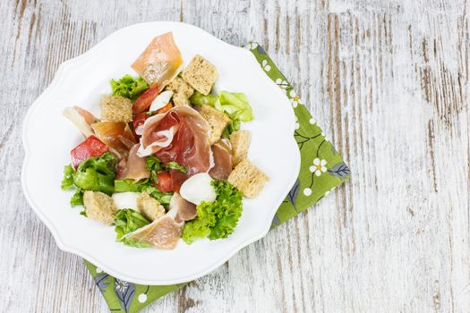 Prosciutto salad with blue cheese.Viewed from above. Copy space composition