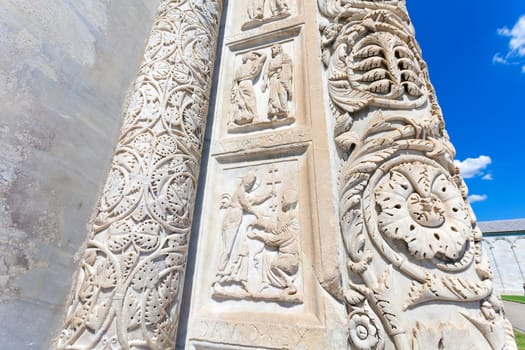 PISA, ITALY - AUGUST 11, 2013: Battistero Pisa entrance sculpture detail, Piazza del Duomo, Italy