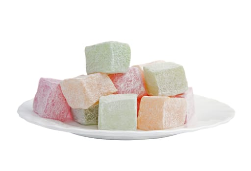 Plate with turkish delight isolated over white background