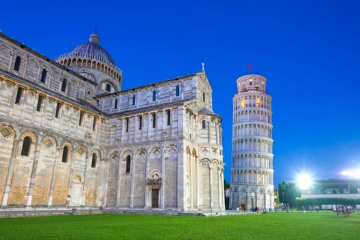 Pisa, Italy - August 11, 2013: Piazza del Duomo with Pisa tower and the Cathedral illuminated at night, Pisa, Italy