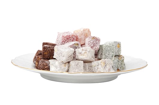 Plate with turkish delight isolated over white background