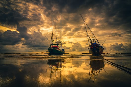 Fishing sea boat and Sunrise clouds before strom in Thailand gold light tone vintage