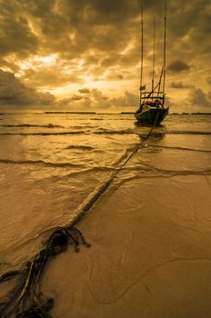 Fishing sea boat and Sunrise clouds before strom in Thailand gold light tone