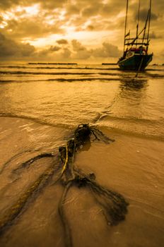 Fishing sea boat and Sunrise clouds before strom in Thailand gold light tone