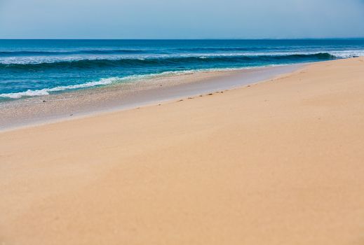 Beautiful surfing tropical sand beach on sunny summer day