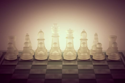 Glass chess concept background .Artistic  toned photo.