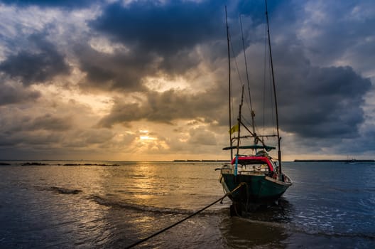 Fishing sea boat and Sunrise clouds before strom in Thailand blue  light tone