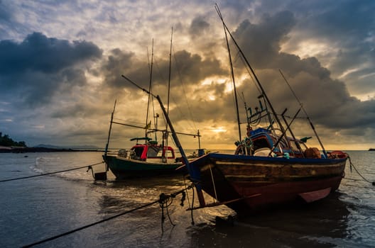 Fishing sea boat and Sunrise clouds before strom in Thailand blue  light tone