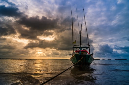 Fishing sea boat and Sunrise clouds before strom in Thailand blue  light tone