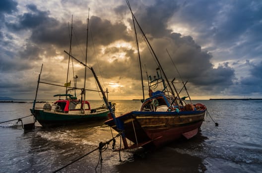 Fishing sea boat and Sunrise clouds before strom in Thailand blue  light tone