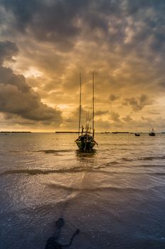 Fishing sea boat and Sunrise clouds before strom in Thailand blue  light tone