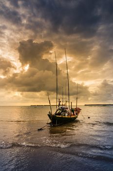 Fishing sea boat and Sunrise clouds before strom in Thailand blue  light tone