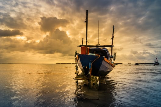 Fishing sea boat and Sunrise clouds before strom in Thailand blue  light tone