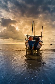 Fishing sea boat and Sunrise clouds before strom in Thailand blue  light tone