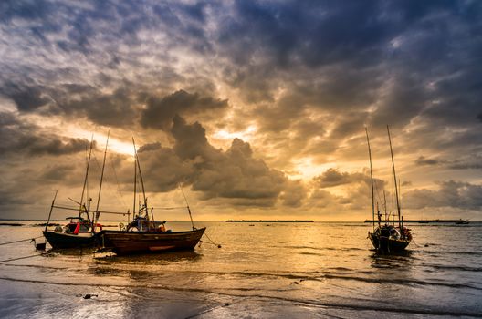 Fishing sea boat and Sunrise clouds before strom in Thailand blue  light tone