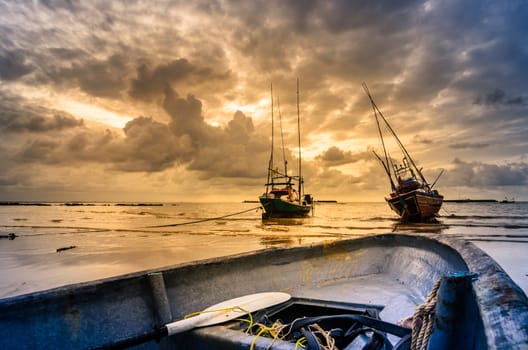 Fishing sea boat and Sunrise clouds before strom in Thailand blue  light tone