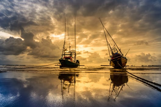 Fishing sea boat and Sunrise clouds before strom in Thailand blue  light tone
