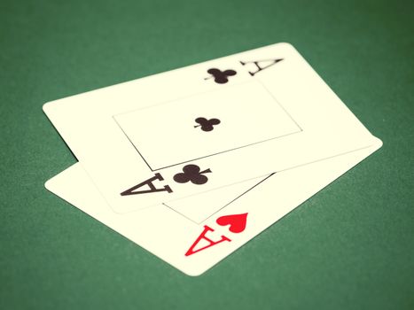 playing cards on a green table casino