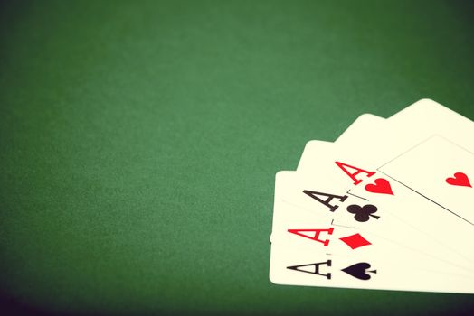 playing cards on a green table casino
