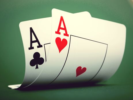 playing cards on a green table casino