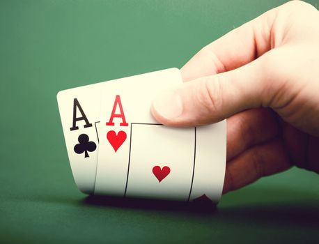 playing cards on a green table casino