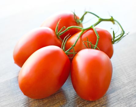 Fresh tomatoes on wooden table