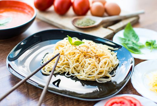 Tasty spaghetti dinner with sauce and basil