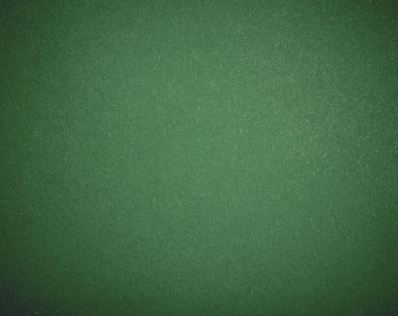 Poker table felt background in green color