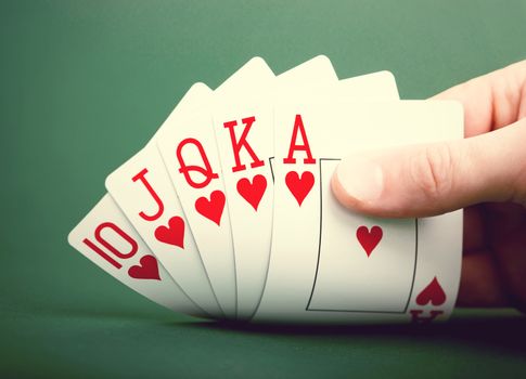 playing cards on a green table casino