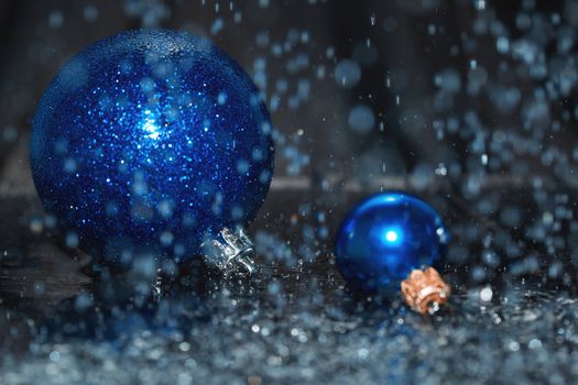 Close-up view of Christmas balls under the rain