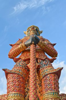 Giant statue holding a baton concierge of temple Thailand