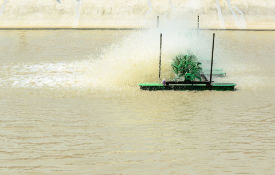 Pump adding oxygen to the water for wastewater treatment in small factories.