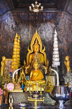 Buddha statue in chapel made of palm wood of Thailand
