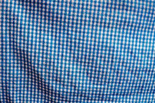 texture of cotton cloth with shadows, vivid color and intense blue and white checkerboard