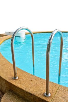 Ladder made of stainless steel and water purifier in the swimming pool on white background
