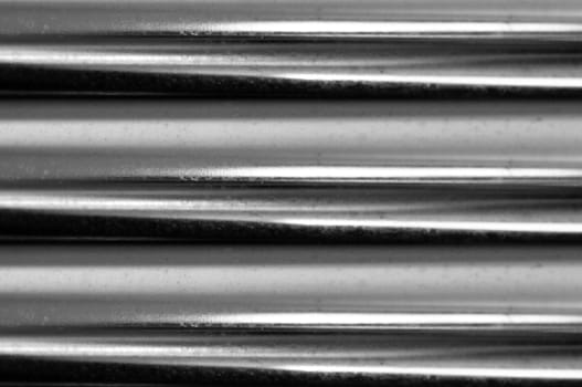 texture of steel tubes with reflections and impurities