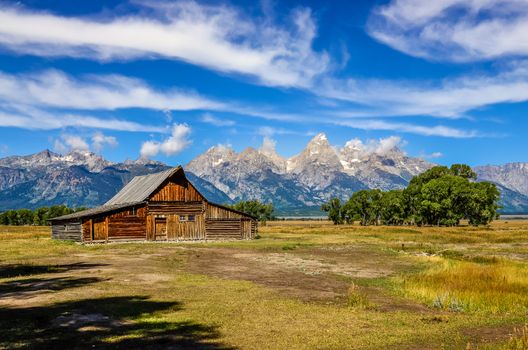 Scenic view of Grand Teton with old wooden farm, Wyoming, USA