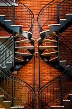 Symmetrical Spinning Staircases and beautiful Orange Brick Wall