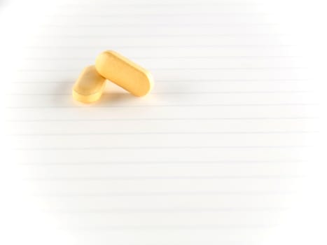 two pills on notebook concept seriousness