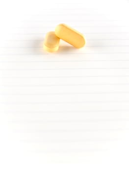 two pills on notebook concept seriousness