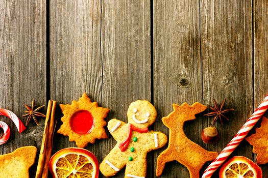 Christmas homemade gingerbread cookies over wooden table