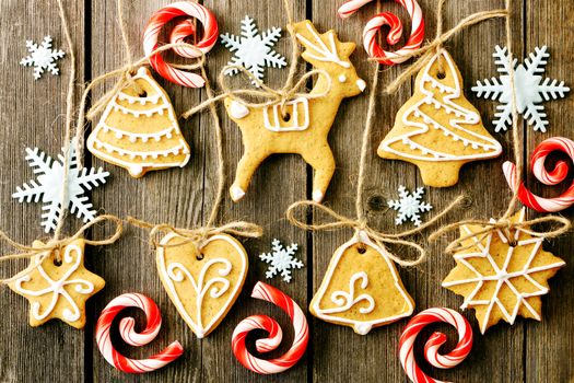 Christmas homemade gingerbread cookies over wooden table