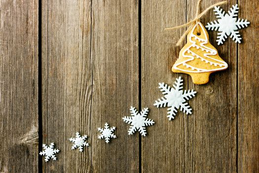 Christmas homemade gingerbread cookies over wooden table